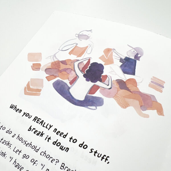 A close up view of a page showing an illustration of three masked people folding laundry together
