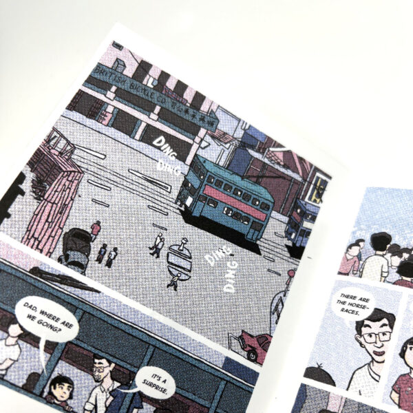 A close up on one of the pages that shows a two-story tram moving through a street while emitting the classic "ding ding" sounds.